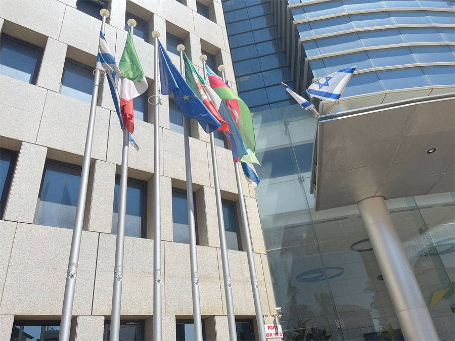 Flags of Israel, the Republic of Azerbaijan and the European Union fly in front of the Republic of Azerbaijan building.